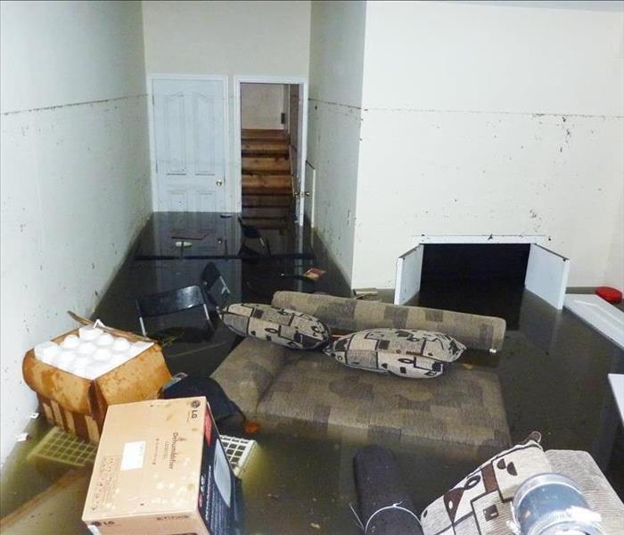 Completely flooded basement with furniture floating